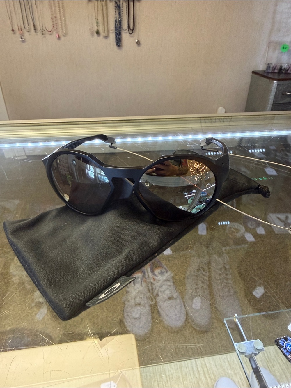 Oakley Men’s Matte Black Wrap Sunglasses with Tinted Lenses